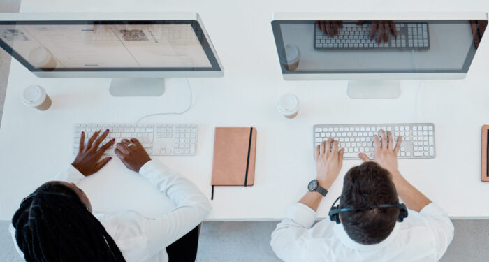 2 telemarketers in a call center