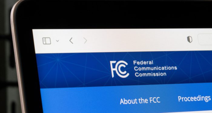 Los Angeles, CA, USA - May 13, 2022: Homepage of the Federal Communications Commission (FCC) is seen on a laptop computer. FCC regulates communications by radio, television, wire, satellite and cable.