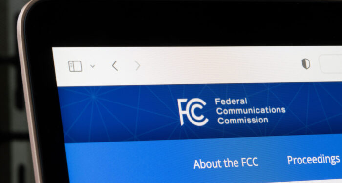 Los Angeles, CA, USA - May 13, 2022: Homepage of the Federal Communications Commission (FCC) is seen on a laptop computer. FCC regulates communications by radio, television, wire, satellite and cable.