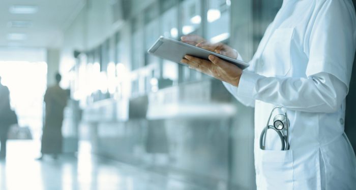 doctor holding a patient file