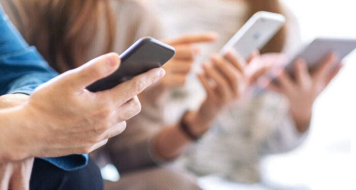 Three people on cell phones